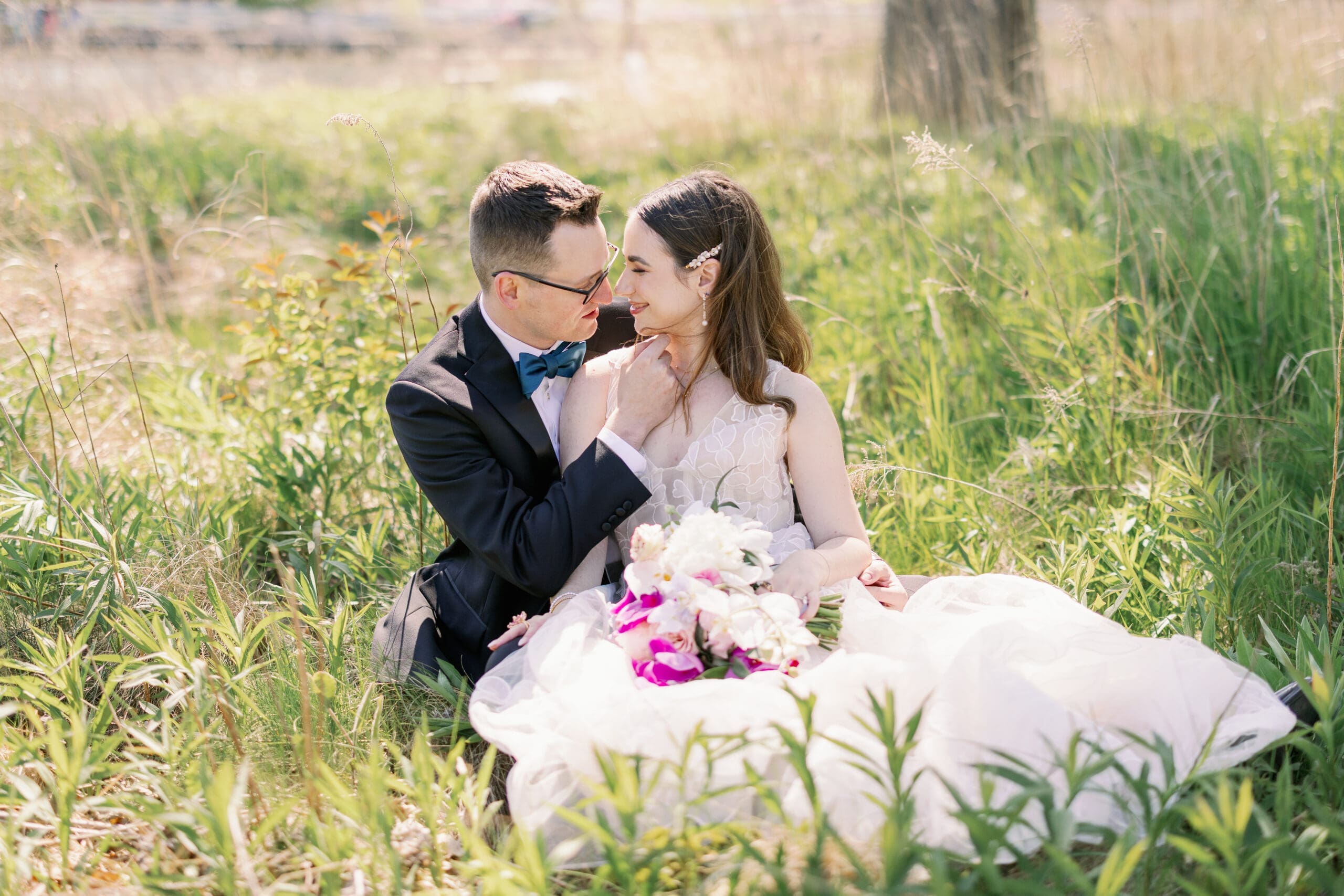 bride and groom sitting for photos at their chicago history museum wedding