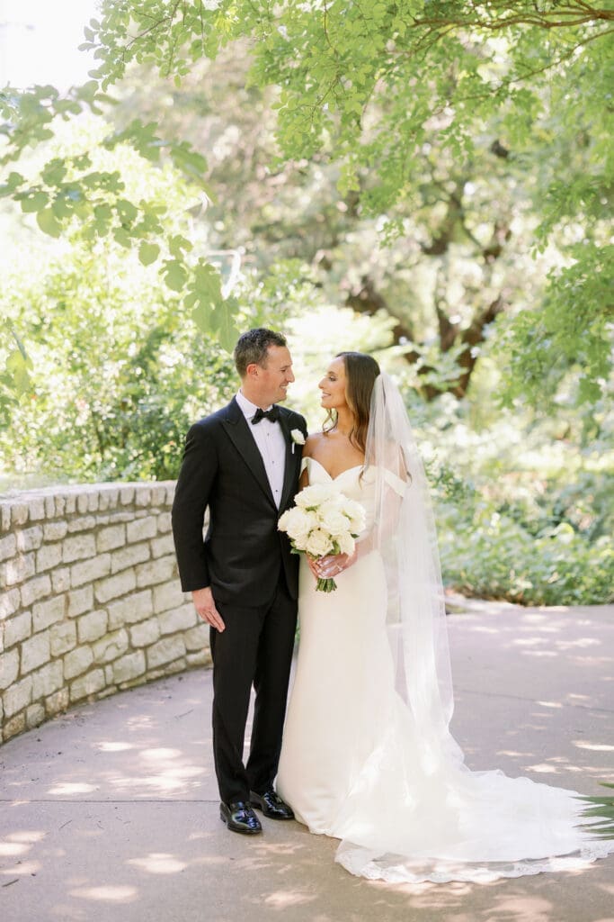 bride and groom smiling at each other for four seasons austin wedding