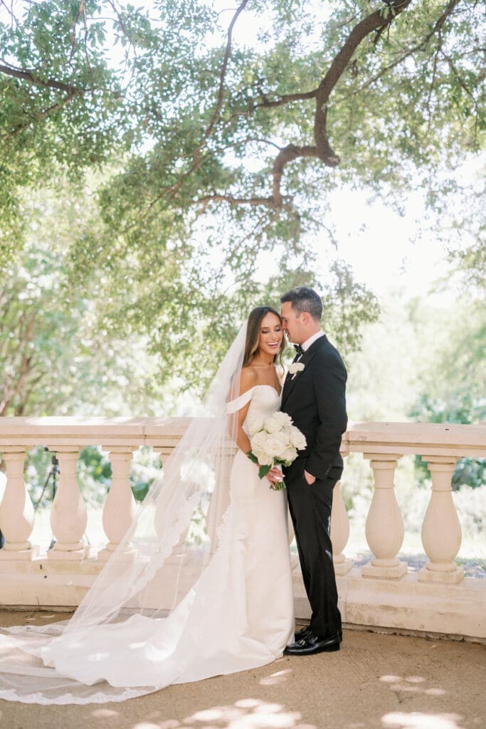 bride and groom posing at four seasons austin wedding