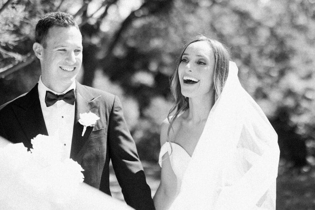 candid laugh of bride and groom at four seasons austin wedding