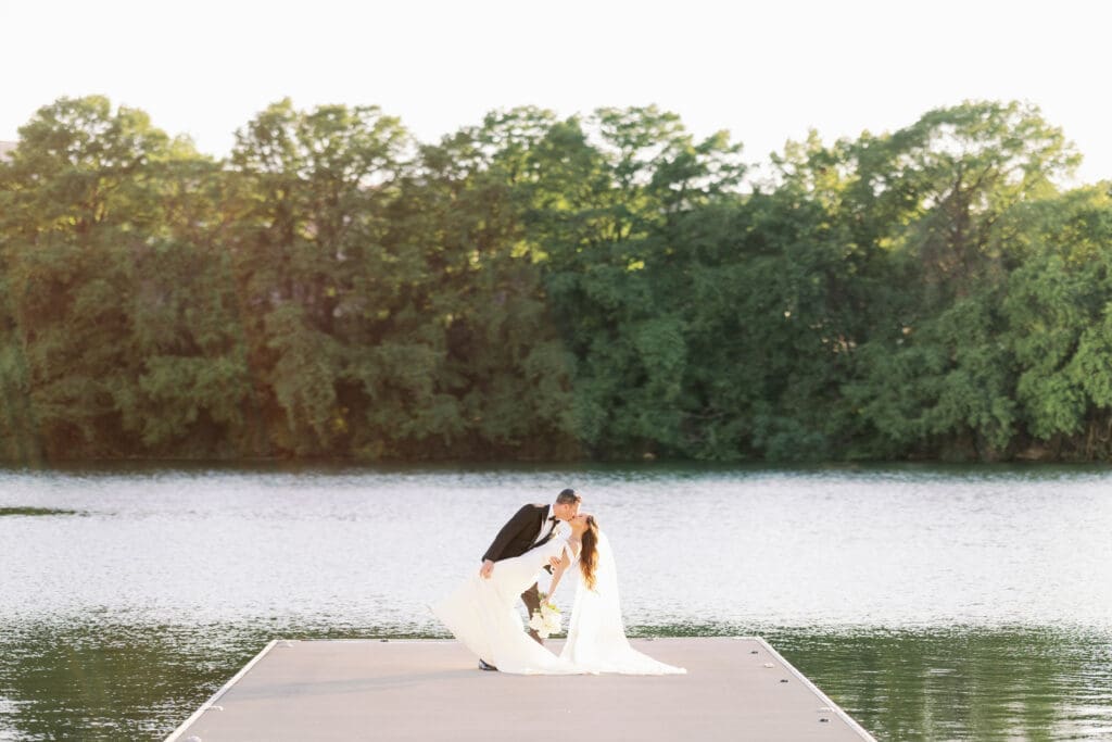 bride and groom kissing in a dip at four seasons austin wedding