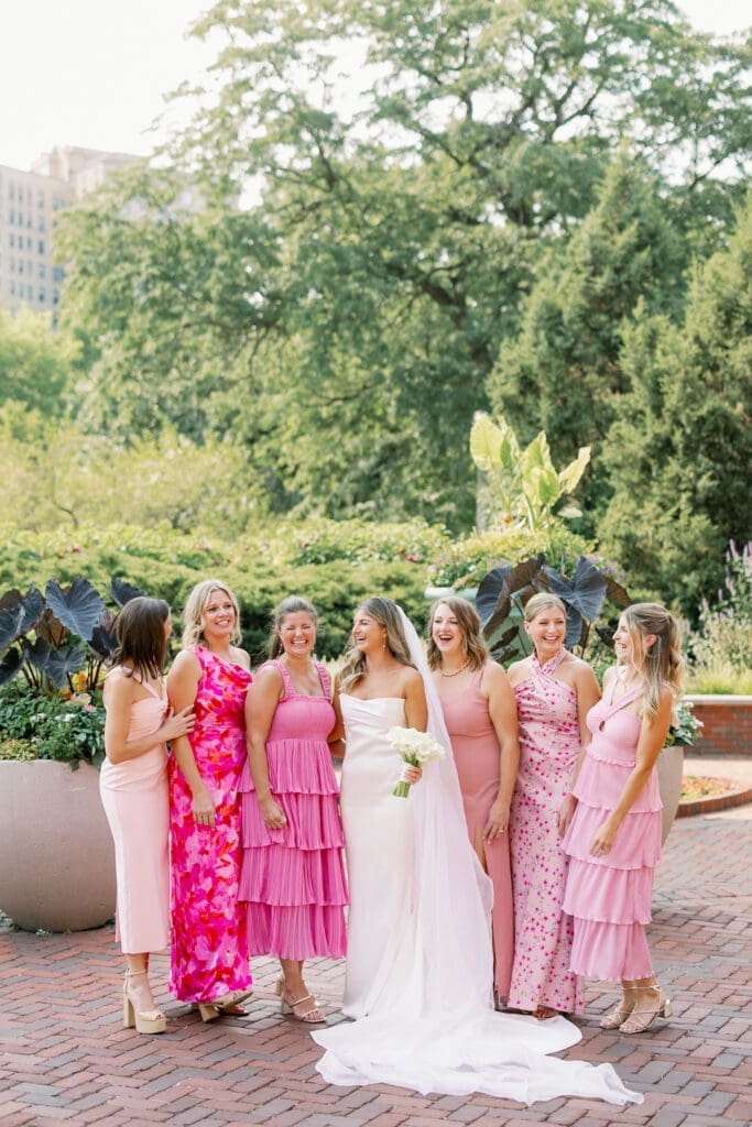 bridesmaids posing outside of cafe brauer