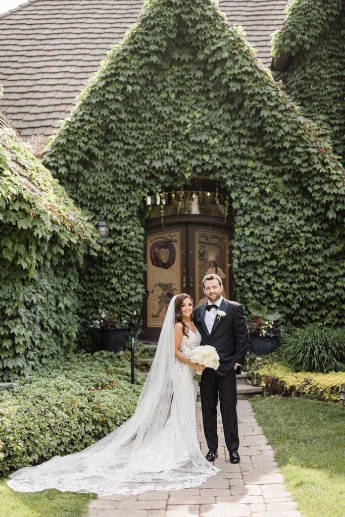 bride and groom in front of montebello estate