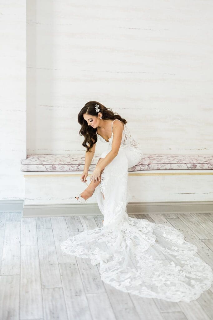 montebello estate bride putting shoes on