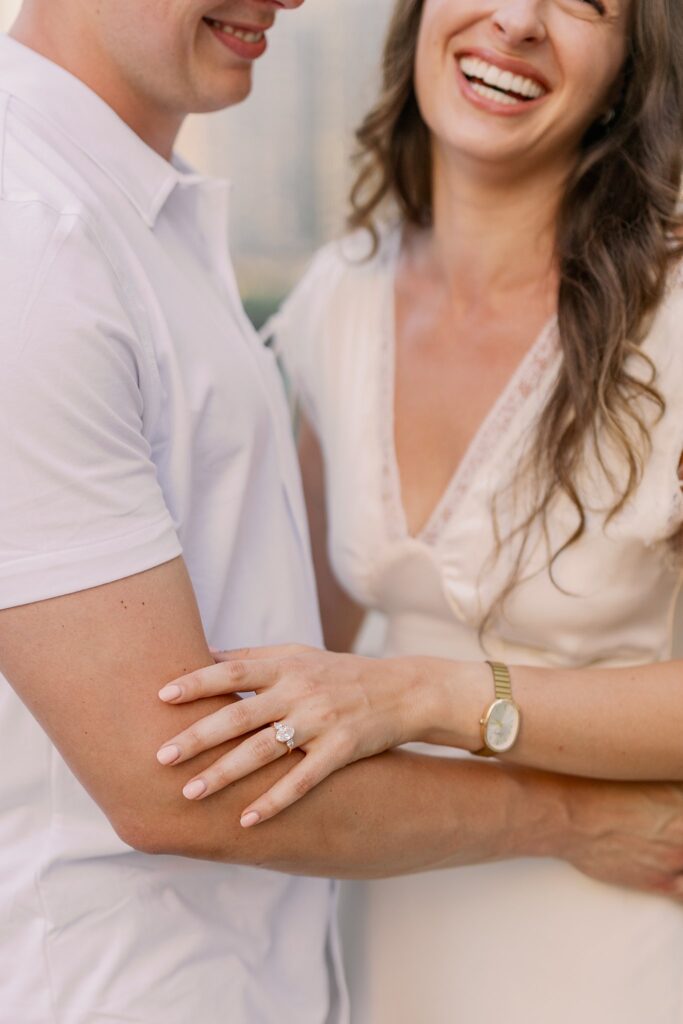 bride and groom posing at chicago riverwalk engagement photos