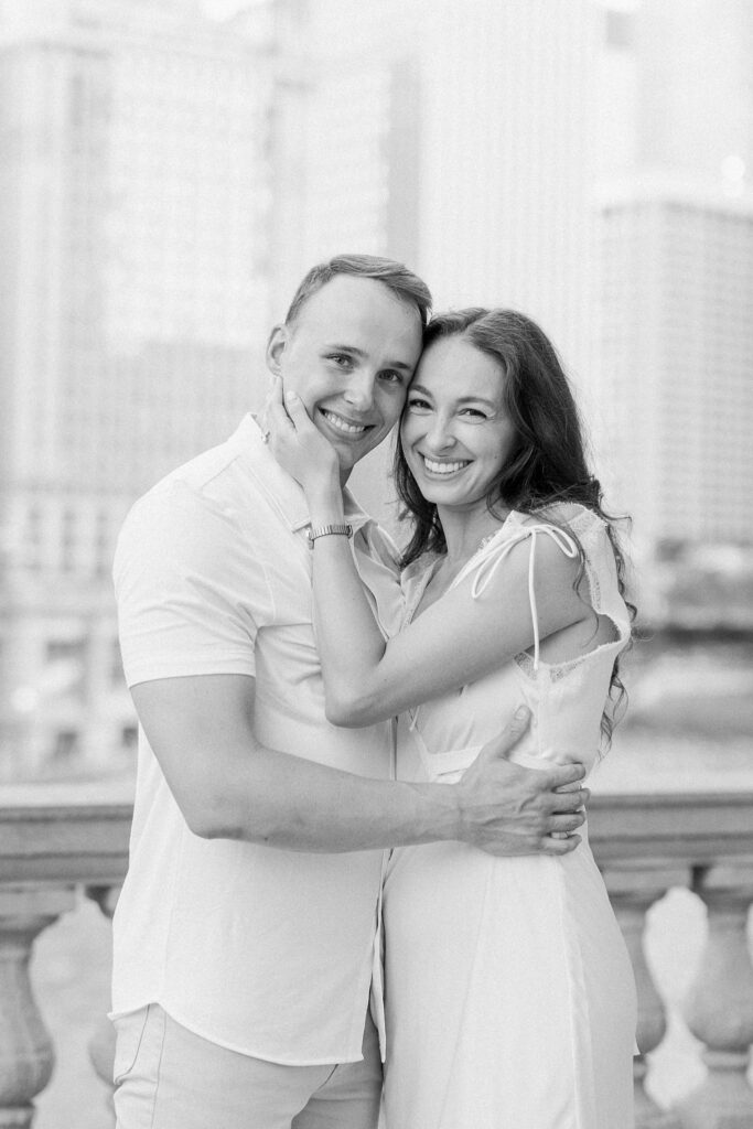 bride and groom posing at chicago riverwalk engagement photos