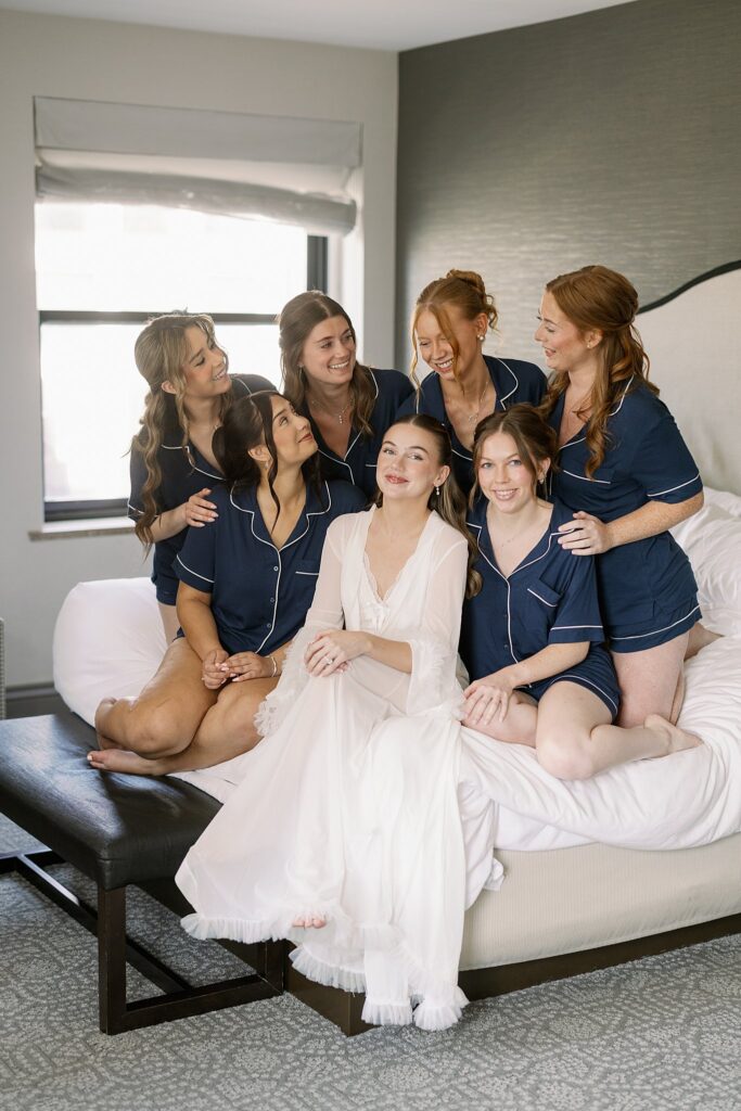 bride and bridesmaids posing in robes before Chicago Winery Wedding