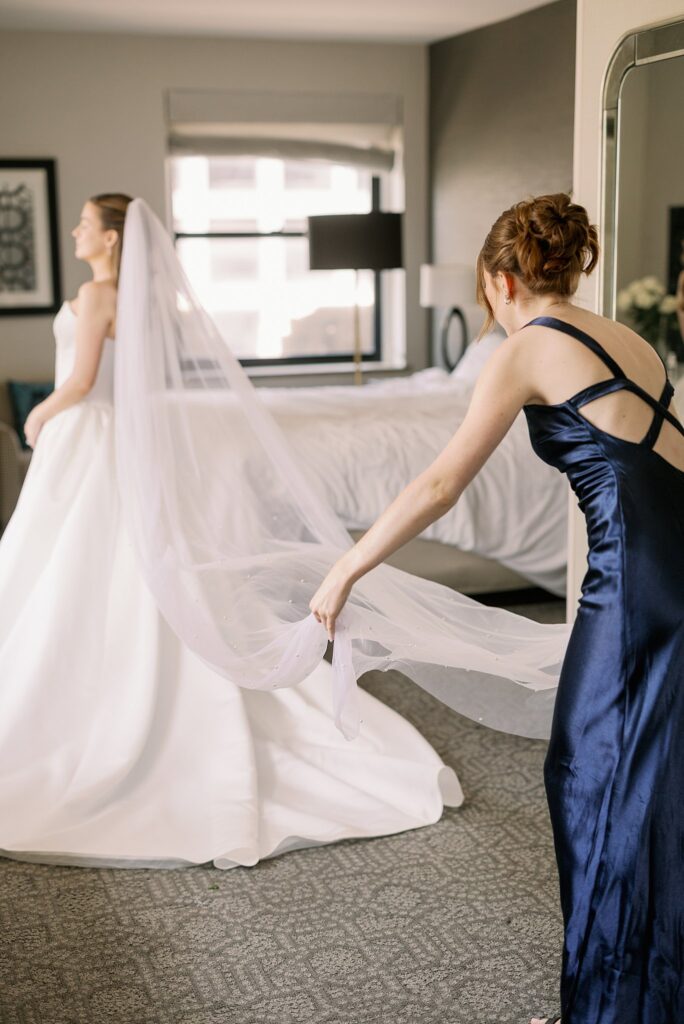 bride getting her veil put on before Chicago Winery Wedding