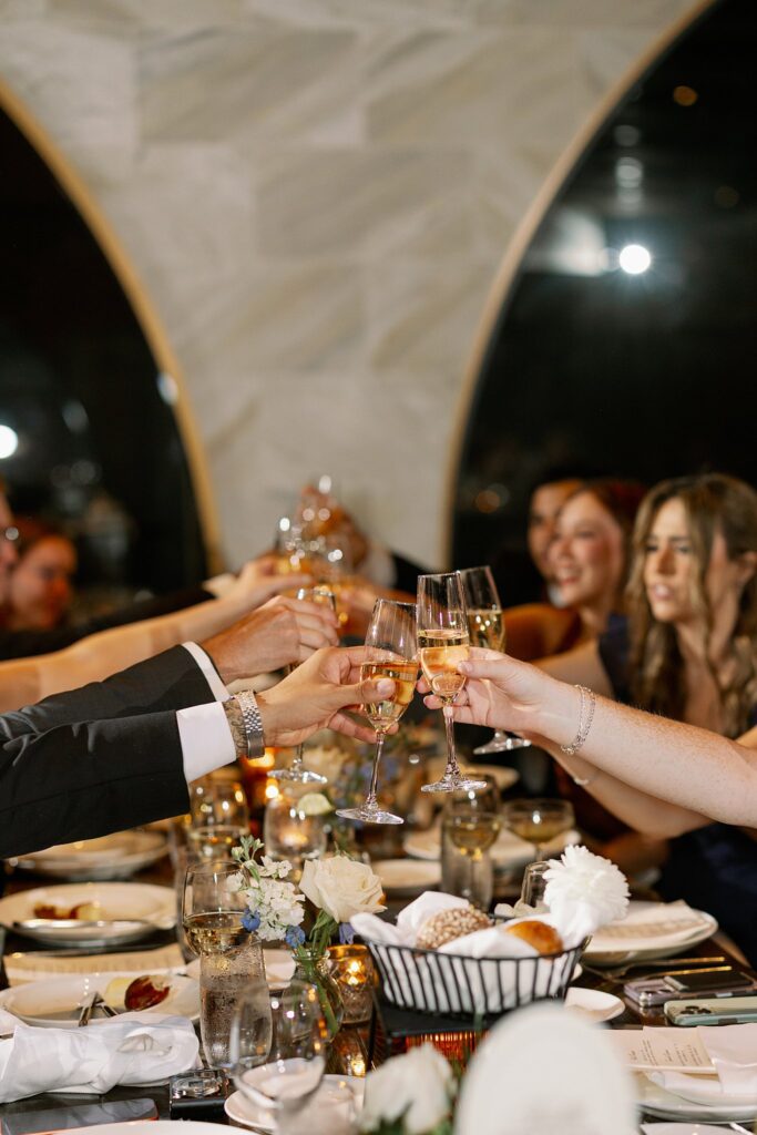wedding guests cheersing at Chicago Winery Wedding