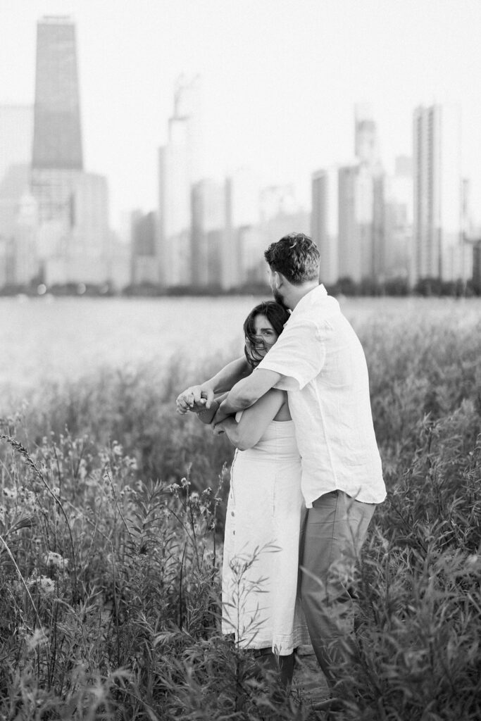 bride and groom posing for north avenue beach engagement photos