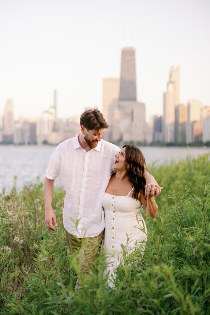 bride and groom posing for north avenue beach engagement photos