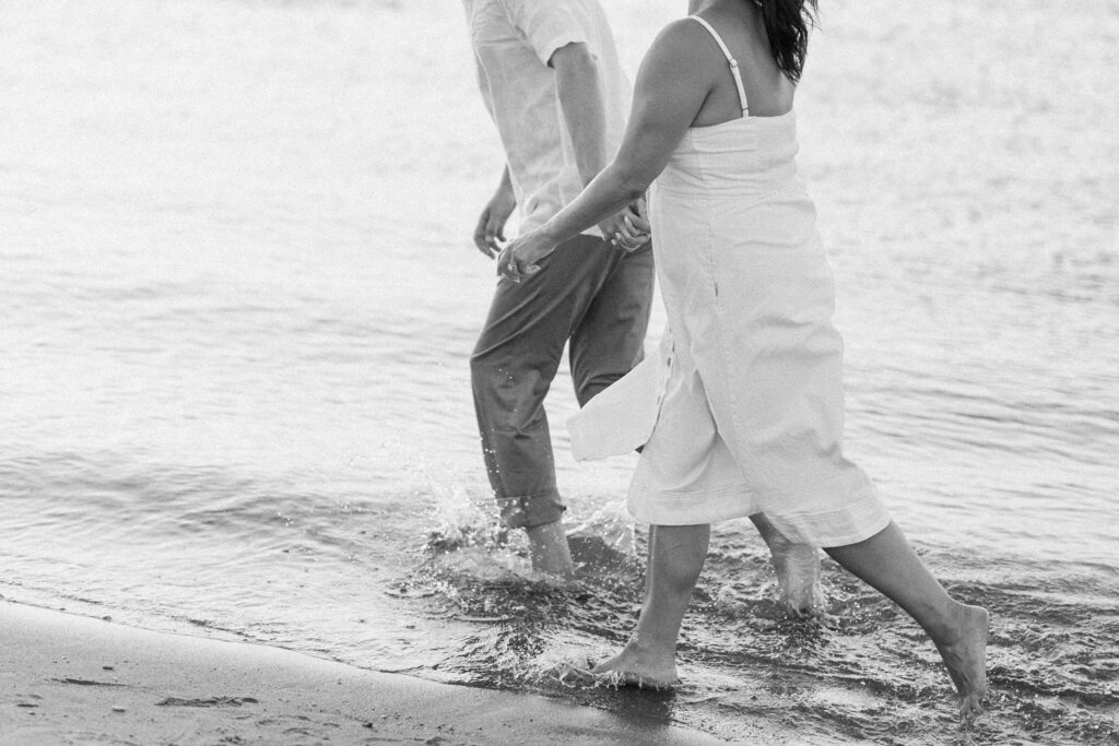 bride and groom posing for north avenue beach engagement photos