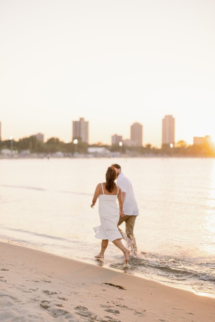 bride and groom posing for north avenue beach engagement photos