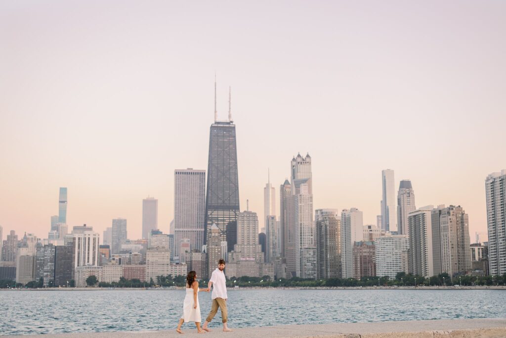 bride and groom posing for north avenue beach engagement photos