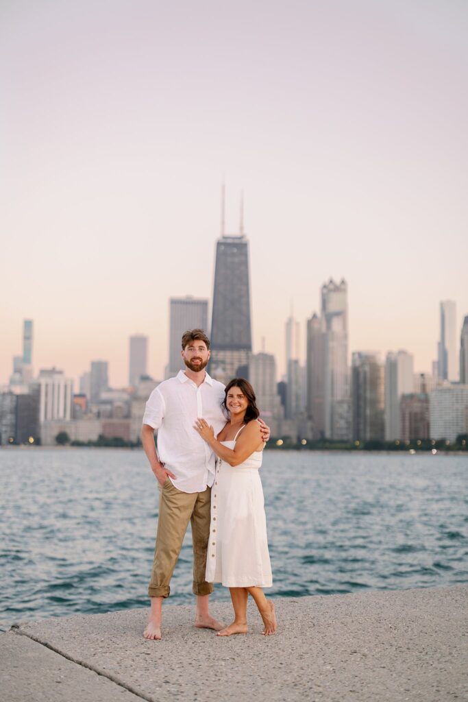 bride and groom posing for north avenue beach engagement photos