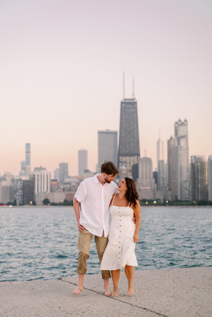 bride and groom posing for north avenue beach engagement photos