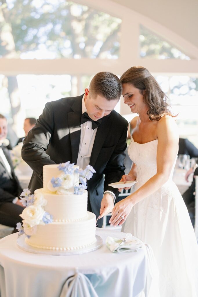 bride and groom cutting wedding cake at stonebridge country club wedding