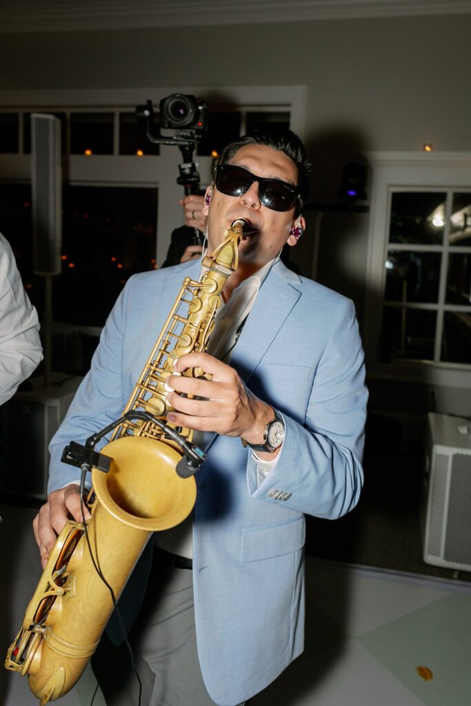 saxophone player on dance floor at stonebridge country club wedding