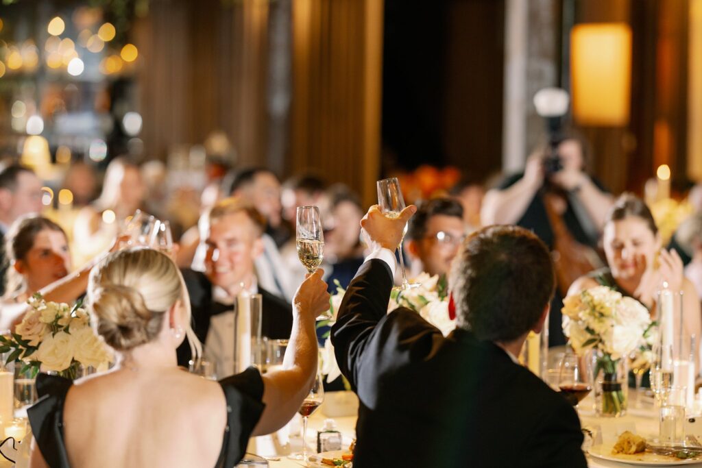 guests cheersing at the dalcy wedding