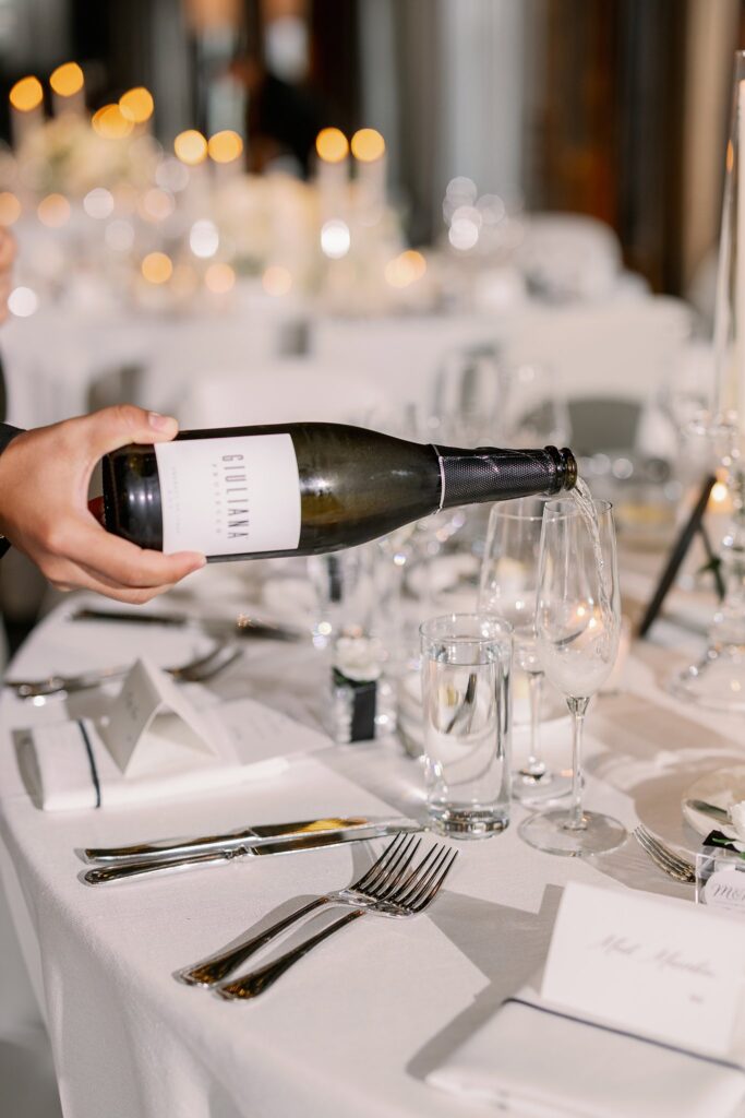 champagne being poured before the dalcy wedding