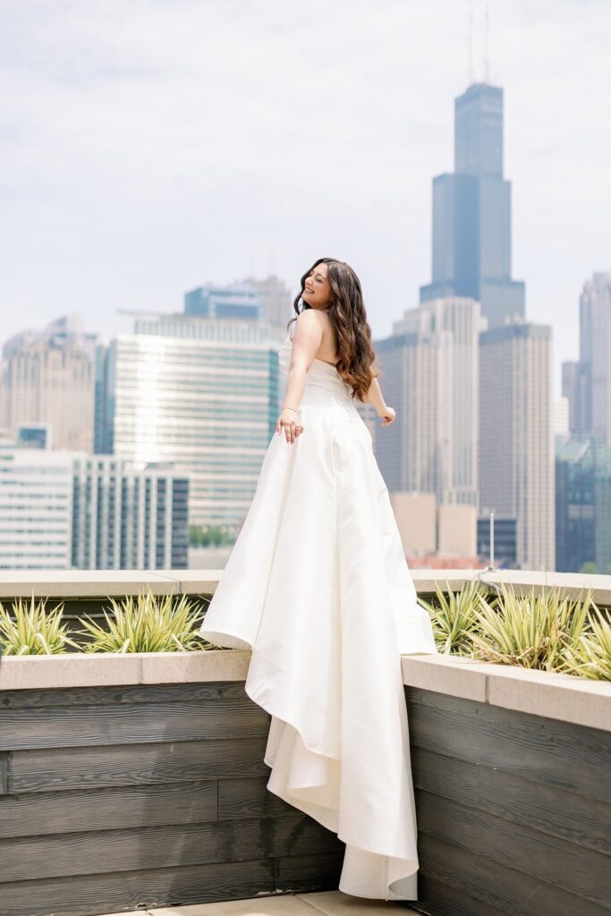 bride posing on rooftop before the dalcy wedding