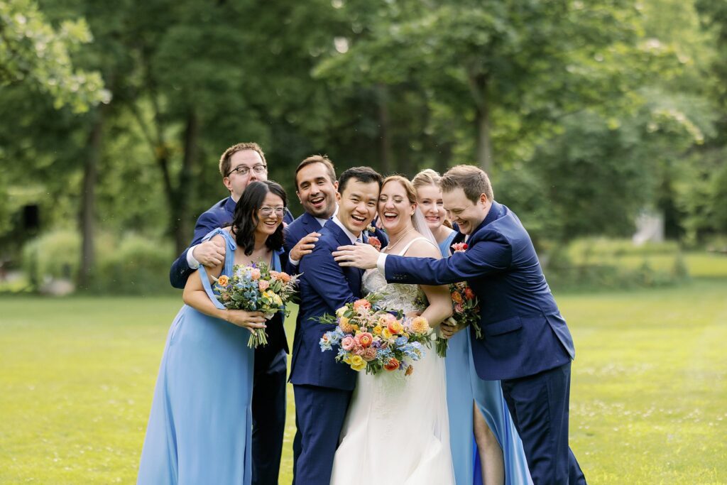 wedding party posing at the grove redfield estate wedding