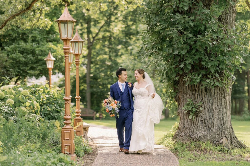 bride and groom pose for the grove redfield estate wedding