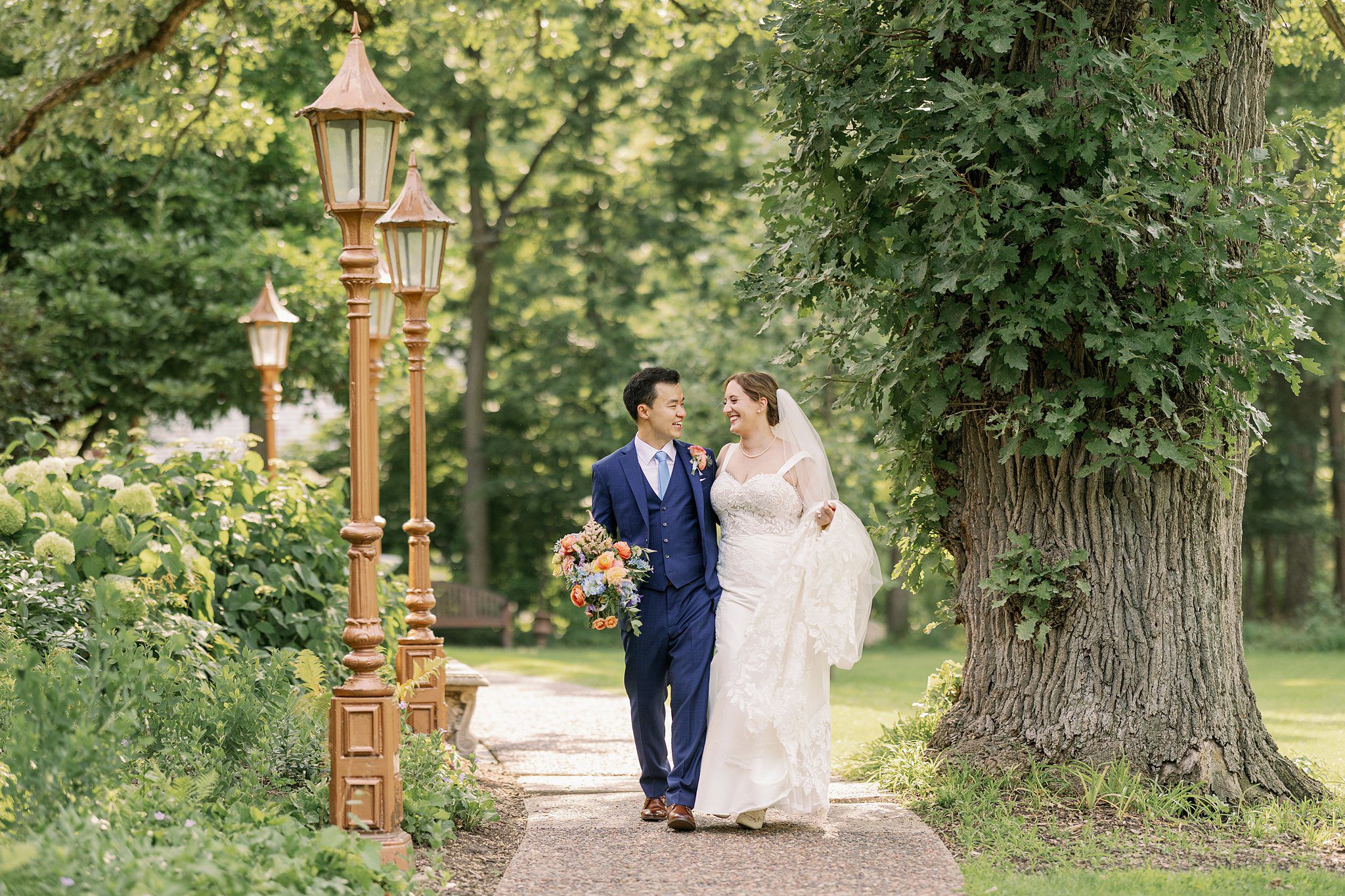 bride and groom pose for the grove redfield estate wedding