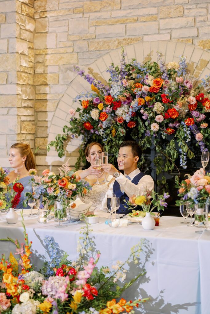 bride and groom cheers at the grove redfield estate wedding