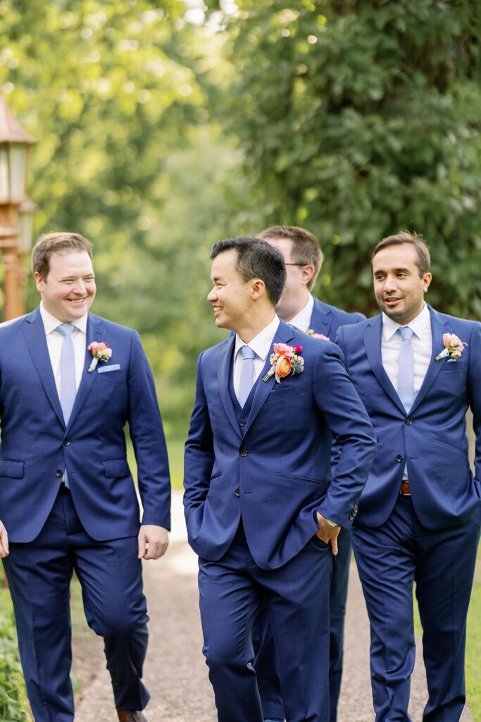 groomsmen posing at the grove redfield estate wedding