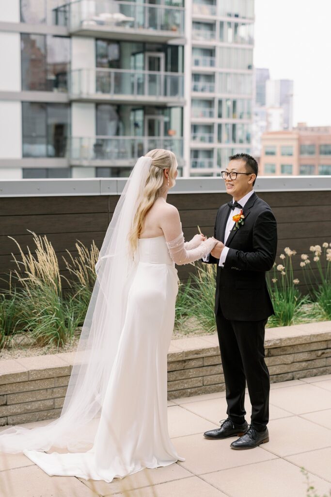 couple has their first look on rooftop before Garfield Park Conservatory Wedding