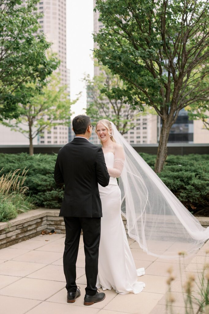 couple has first look on a rooftop before their Garfield Park Conservatory Wedding