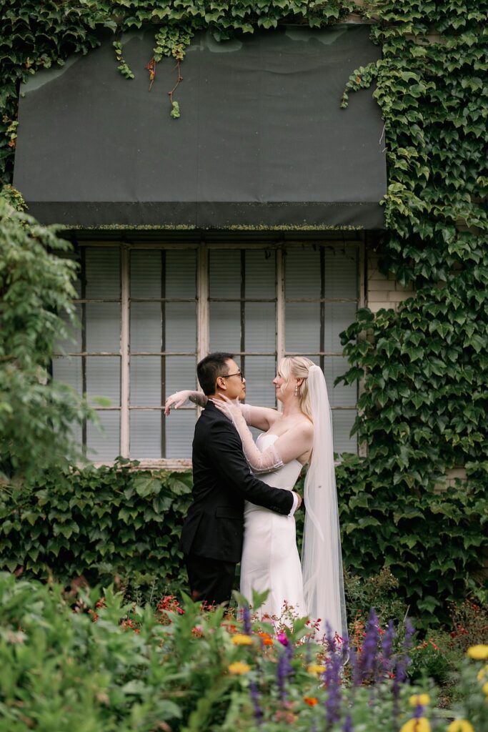 bride and groom pose outside at Garfield Park Conservatory Wedding